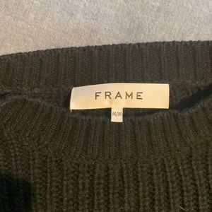 Medium, cotton cable knit sweater, with soft shoulder padding, in black.